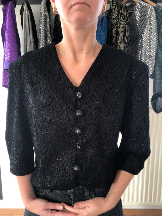 Blouse noire et paillettes